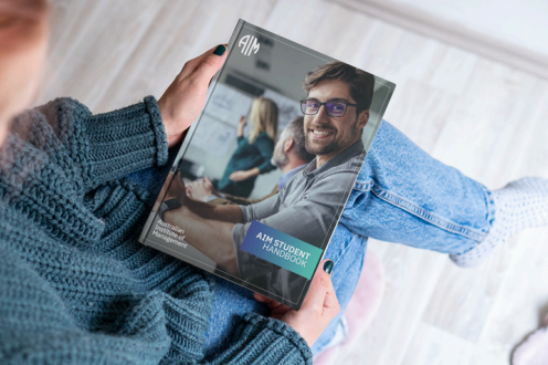 Cover of the AIM Student Handbook containing course policies and support information